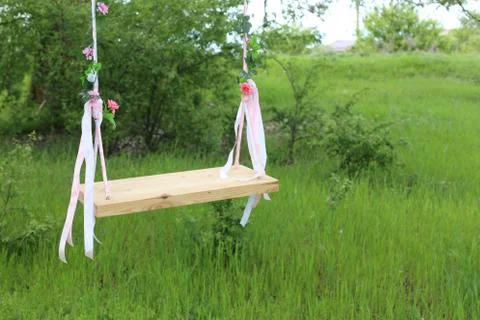 Empty swing in nature Stock Photos