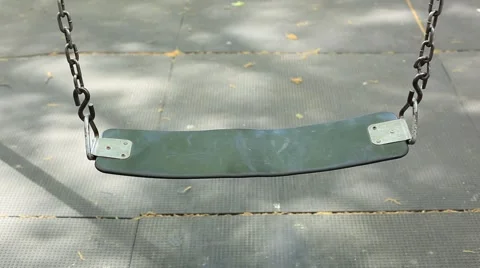 EMPTY SWING-NYC-LOOK DOWN-CITY PLAYGROUND Stock Footage 973337