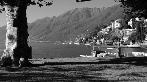 Empty Swing over Alpine Lake Maggiore with Mountain View in a Sunny Day Stock Footage 165201350