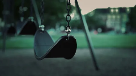 Empty swing in park during evening hours with no children 4k Video stock 64832907