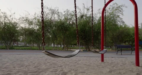 Empty Swing in the park Stock Footage 256076213