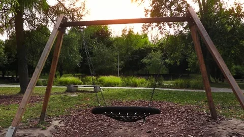 Empty swing in the park. Park swing swings without people. Stock Footage 317555849