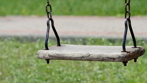 Empty swing at the playground on the chain Stock Footage 130381103