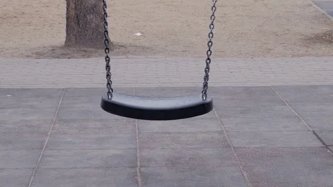 Empty swing in playground Stock Footage 82513652