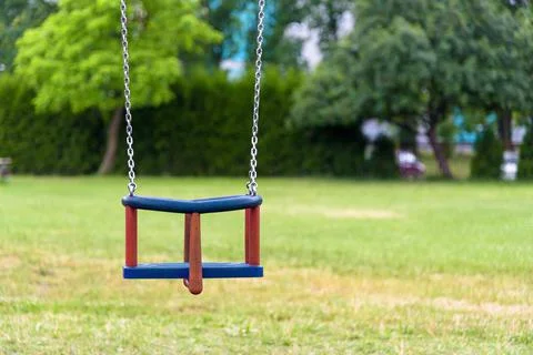 Empty swing on the playground Stock Photos