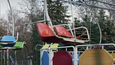 Empty Swing Ride at Abandoned Amusement Park Stock Footage 326036461
