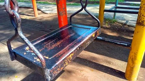 Empty Swing Seat in Playground Stock Photos