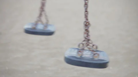 Empty swing set at children's playground Stock Footage 56886910