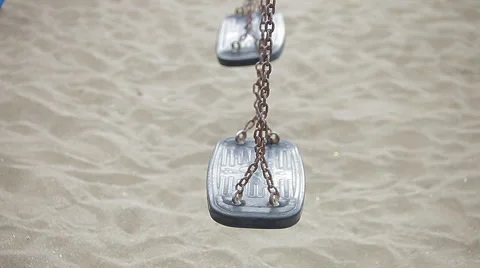 Empty swing set at children's playground on the beach 스톡 동영상 56896242