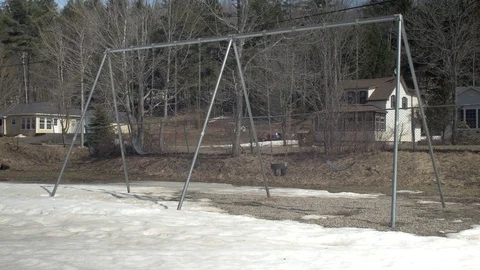 Empty Swing Set in the Spring. Stock Footage