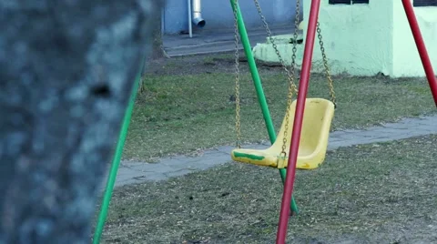 Empty swing in the street Stock Footage 68538392