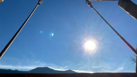 Empty Swing with Sunlight and Mountain View 库存影片 194011997