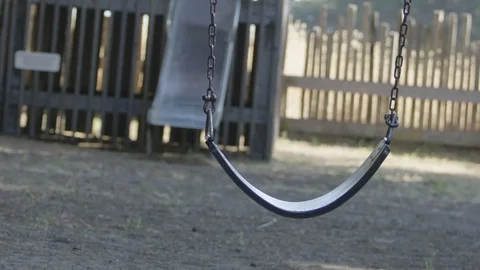 Empty Swing Swaying on Playground 스톡 동영상 85455841