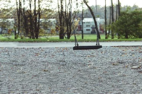 Empty swing swings on the children playground Stock Photos