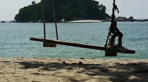 Empty swing on a tropical beach Stock Footage 60259826