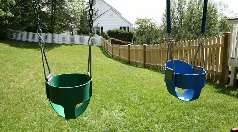 Empty swings in a backyard Video stock 478101
