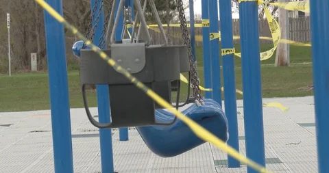 Empty Swings - Closed / Restricted Playground - Pandemic - COVID-19 Stock Footage 128783533