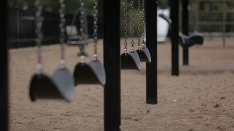 Empty swings at a lonely empty playground Stock Footage 87721438