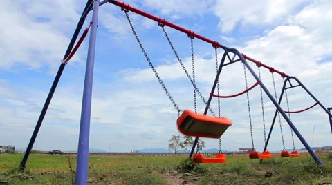 Empty Swings on Outdoor Playground Stock Footage 62420389