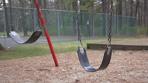 Empty swings at a park Stock Footage