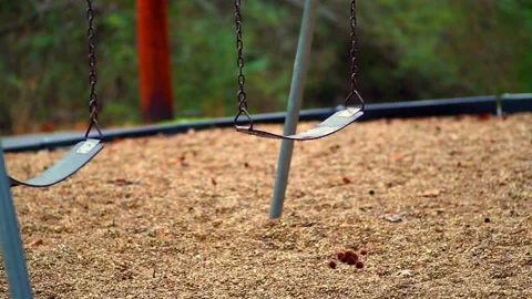 Empty swings in a park Stock Footage 133658540