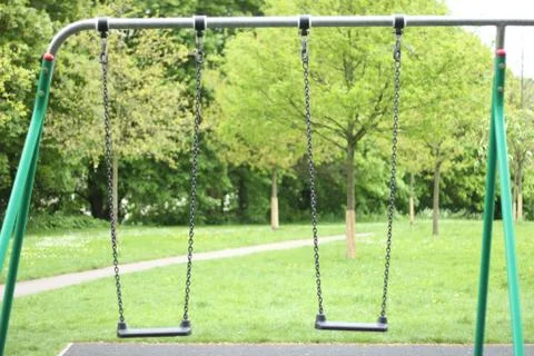 Empty swings Stock Photos