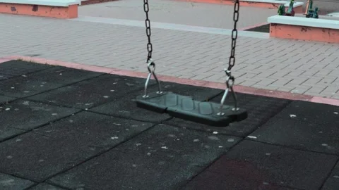 Empty swings on a playground during a state of emergency Stock Footage 257530882