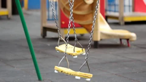 Empty swings in a playground Stock Footage 11151019