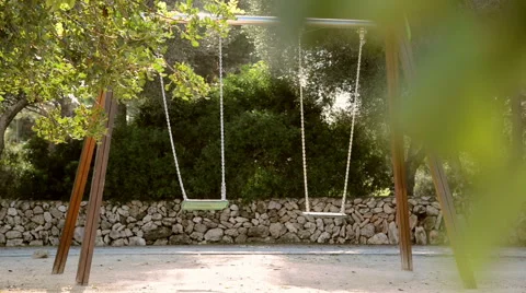Empty swings in a playground Stock Footage 45988307