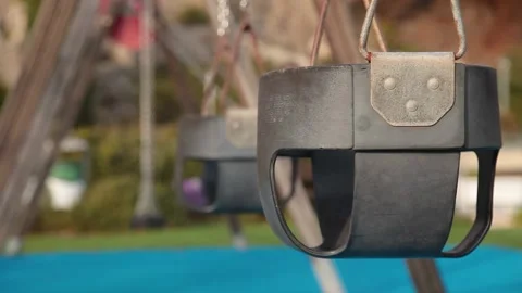 Empty swings in the playground Stock Footage 170754929