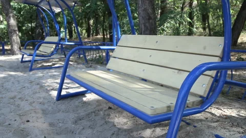 Empty swings in the playground 動画素材 202101315