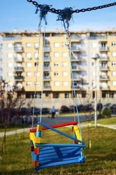 Empty swings in the playground Stock Photos