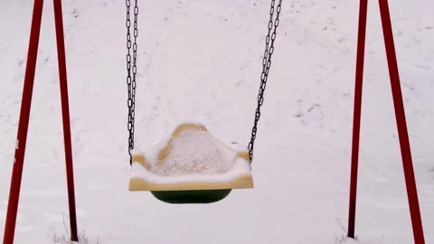 Empty swings in winter Stock Footage 166683826