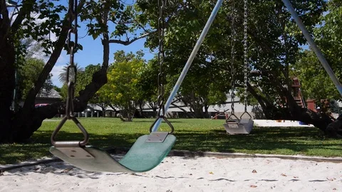 Empty swingset on a playground. handheld static Stock Footage 106885558