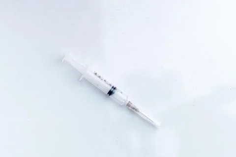 Empty Syringe against white void with copyspace. Stock Photos
