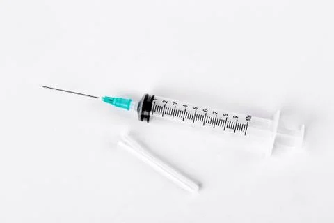 Empty syringe on white background. Stock Photos