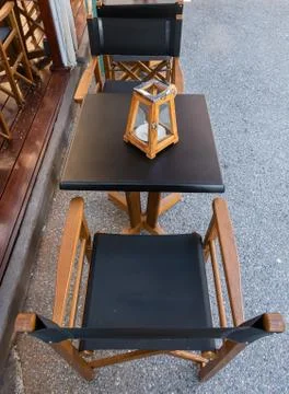 Empty table and chairs of a restaurant Stock Photos
