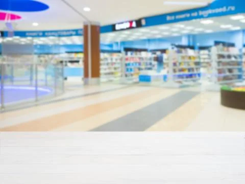 Empty table and shopping mall blur 스톡 사진