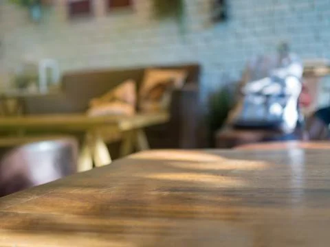 Empty table with blurry cafe background Stock Photos