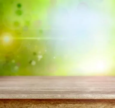 Empty table in front of abstract green background Illustrazione stock