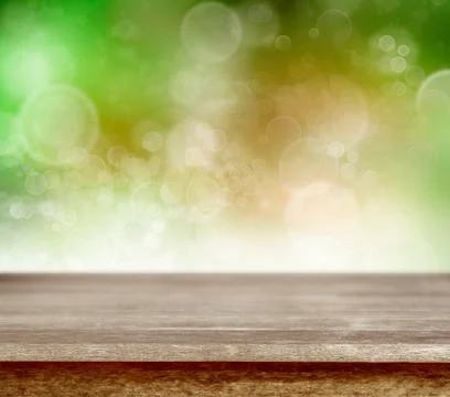 Empty table in front of abstract green background Illustrazione stock