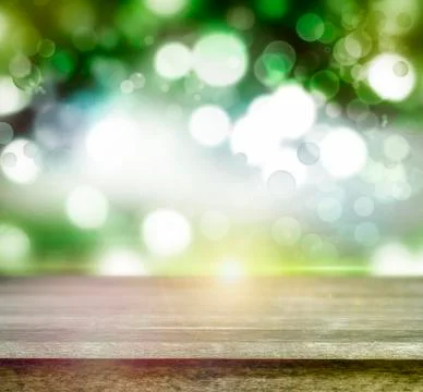 Empty table in front of abstract green background Stock Illustration