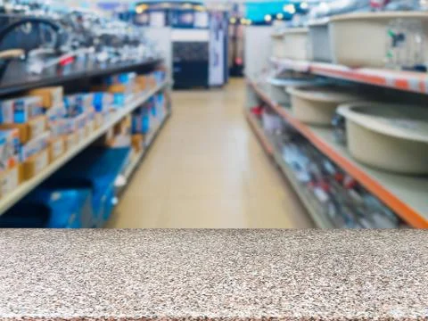 Empty table in front of blurred DIY supermarke 스톡 사진