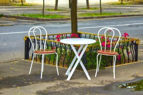 Empty table in outdoor cafe or restaurant Stock Photos