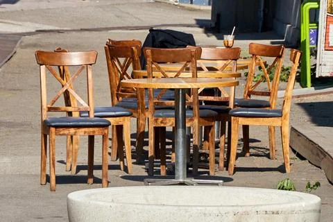 An empty table of an outdoor cafe Stock Photos