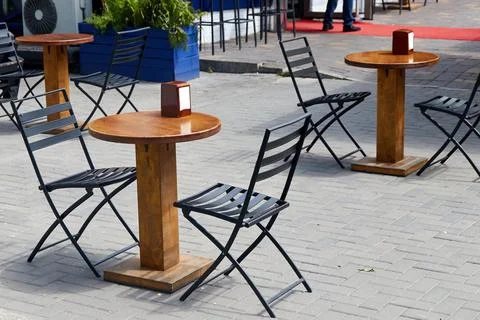 An empty table of an outdoor cafe Stock Photos