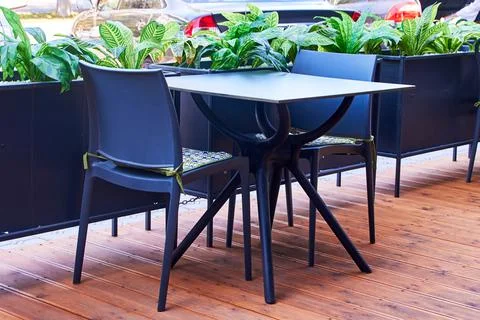 An empty table of an outdoor cafe Stock Photos