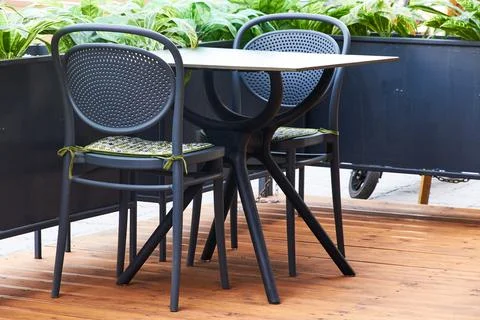 An empty table of an outdoor cafe Stock Photos