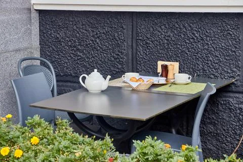 An empty table of an outdoor cafe Stock Photos