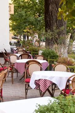 An empty table of an outdoor cafe Stock Photos